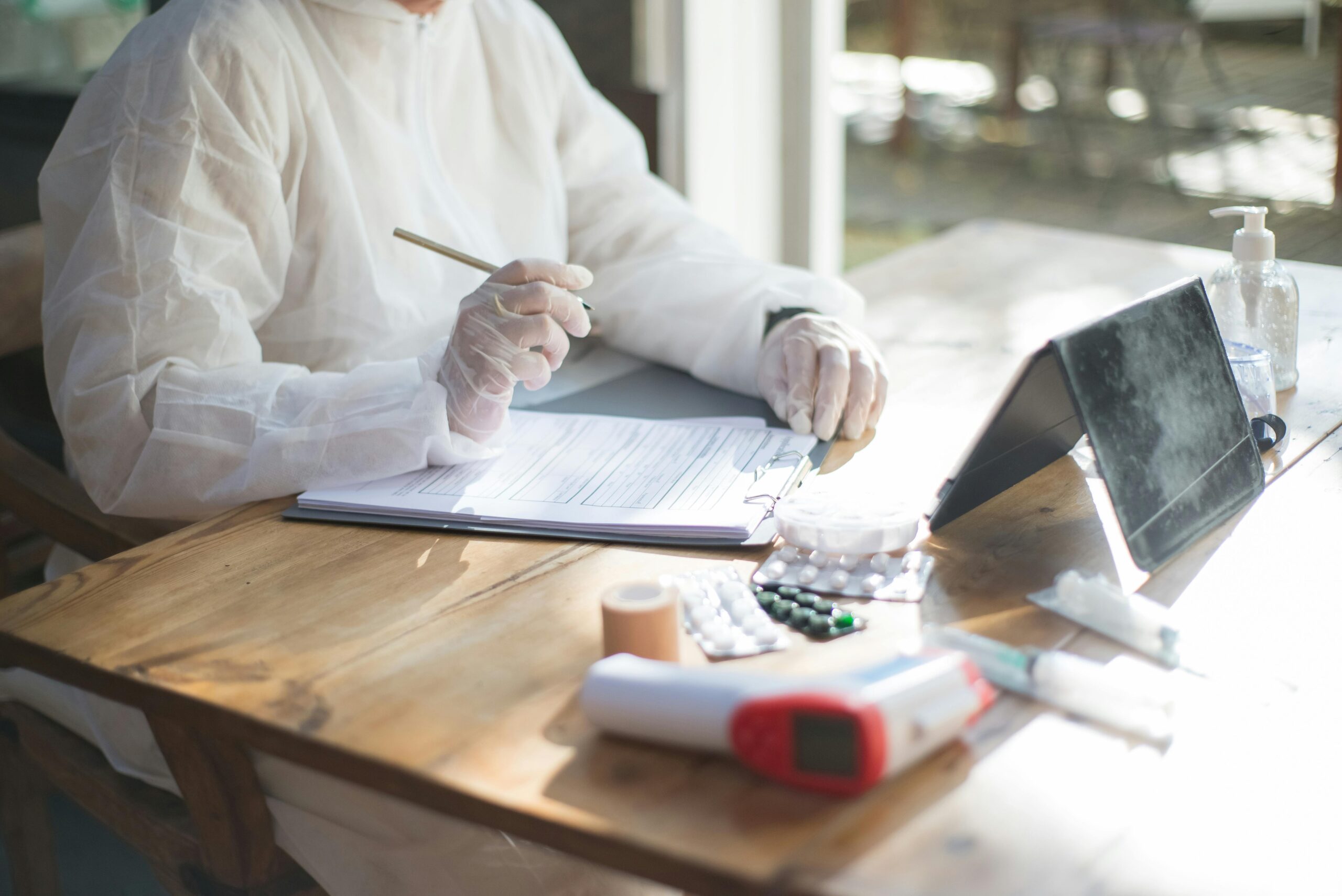 physician taking prescription notes